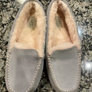 Warm UGG sippers in a light gray color.